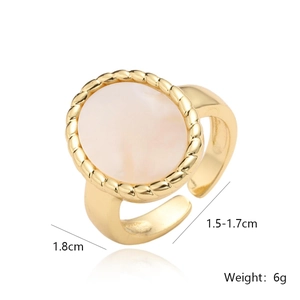 Macro detail of 18K gold plated ring featuring white shell inlay and rope texture edges