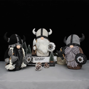 Three Viking gnome plush dolls with horned helmets, axes, and shields on a desk decor