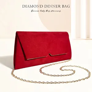 Elegant deep red velvet evening clutch bag with gold chain and geometric flap detail