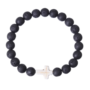 Detailed view of matte black lava stone beads with a white synthetic stone cross charm