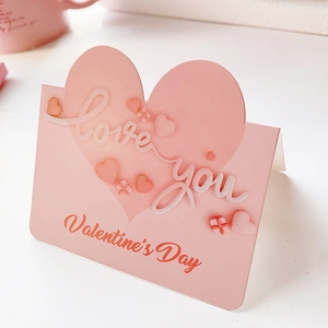 Pink heart Valentine's Day greeting card with 3D love you text and paper material