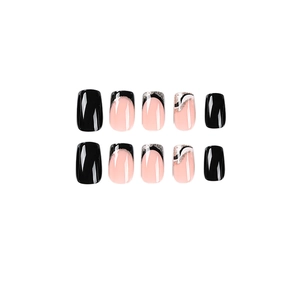 French tip press-on nails with black and white wavy patterns and silver glitter