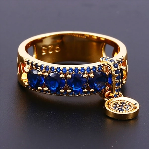 Gold-plated 925 sterling silver ring featuring a blue zircon disc pendant on a black background