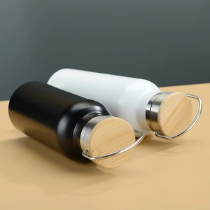 Top view of double-wall stainless steel travel bottles with natural bamboo lids and metal loops