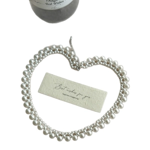 Elegant double-layered stainless steel pearl necklace arranged in a heart shape