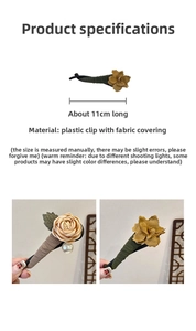 Detailed view of an 11cm vintage floral hair claw with fabric roses and pearl accents