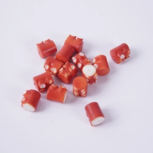 Artificial squid tentacle pieces for DIY food play, featuring red and white resin texture