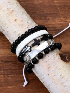 Detail showing set of four beaded and leather bracelets featuring cross pendant and silver plates