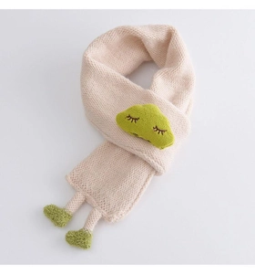Detail of soft knitted beige baby scarf with green cartoon character and slip-through design