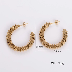 Detail view of 35mm gold hoop earrings showing wire-wrapped texture and 9.6g weight