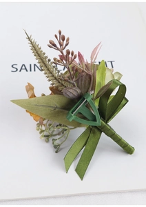 Detail of Morandi-style artificial boutonniere with green ribbon and secure T-clip