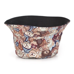 Close-up of jacquard cartoon bear patterns and textured fabric on the bucket hat