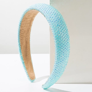 Close-up of light blue headband featuring sparkling rhinestones and non-slip velvet lining
