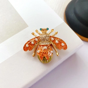Baroque vintage bee brooch with orange enamel, white pearls and crystal details