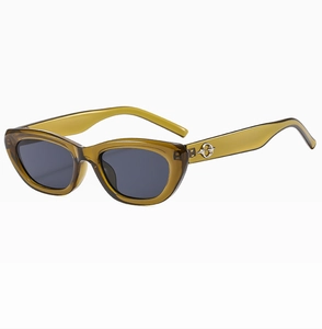 Close-up of olive green cat eye sunglasses with silver metal hinge detail