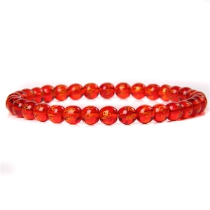 Detailed view of 6mm red agate beads featuring engraved golden Sanskrit characters