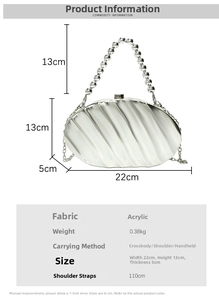 Detailed view of silver shell-shaped acrylic evening bag with pearl handle and chain strap