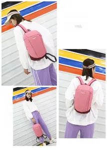 Detailed view of a pink water-resistant nylon sports backpack for women with SPORTS text