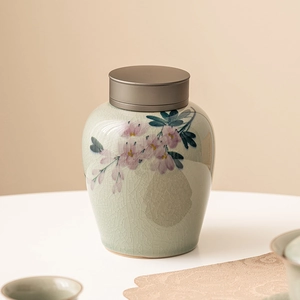 Hand-painted ice-crack glaze ceramic tea canister with pink floral pattern and metal lid