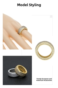 Detail of hip hop style wide ring featuring pavé set zircons in gold and silver finish