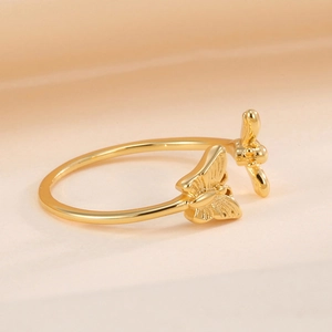 Elegant gold open butterfly ring with polished texture and minimalist adjustable design