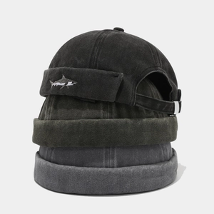 Stacked washed cotton Miki hats in grey tones with shark embroidery and metal buckle