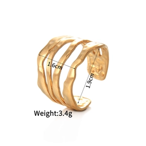 Detail showing gold layered wave ring with hammered texture and 1.6cm width