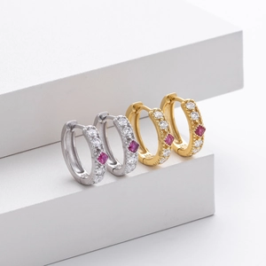 Detailed macro view of S925 sterling silver hoop earrings with square purple zircons