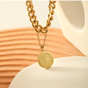 Detail of 18k gold plated double layer necklace with Elizabeth II coin pendant charm