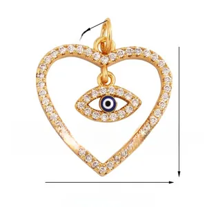 Macro detail of heart evil eye pendant with blue enamel and dimensions 19mm by 19mm
