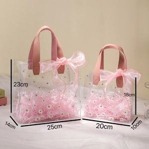 Daisy print transparent PVC gift bags in two sizes with pink ribbon handles and bows