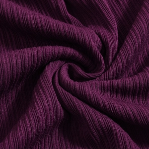 Detail of dark purple ribbed knit fabric texture with high elasticity and soft finish