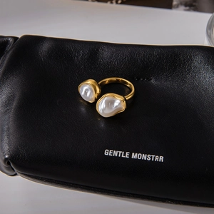Elegant 18K gold-plated open ring with twin baroque pearls on black leather background