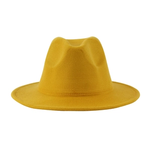 Detailed view of a bright yellow wool felt fedora with a classic creased crown and flat brim