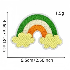 Detail of embroidered rainbow patch in green, white, and orange with size measurements