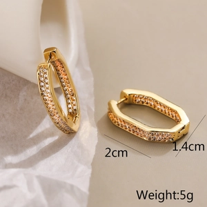 Detail of gold geometric earrings with zircon inlay showing 2cm x 1.4cm dimensions