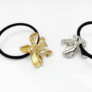 Elegant gold and silver irregular leaf metal hair ties for a minimalist ponytail look