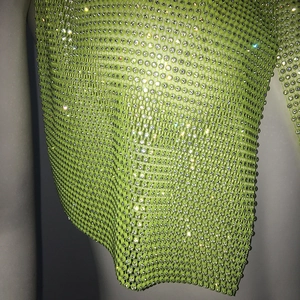 Detail of neon green rhinestone mesh headwear with shiny crystals for party festivals