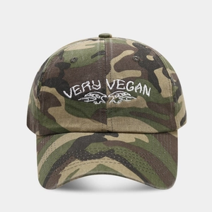 Detail of Very Vegan white embroidery on jungle camouflage canvas baseball cap