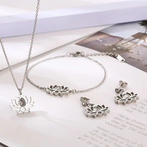 Elegant stainless steel jewelry set featuring hollow lotus pendants with teardrop zircon