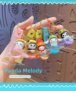 Detail of Sanrio character liquid oil keychains in airplane shapes with glitter and straps