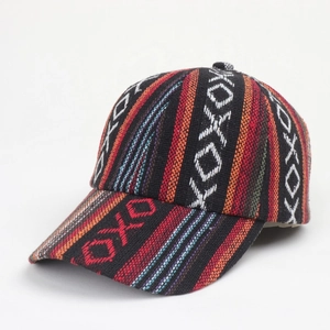 Close-up of Bohemian baseball cap showing ethnic woven texture and geometric patterns