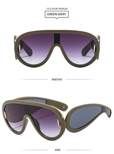 Front and side views of Y2K oversized one-piece sunglasses in green and gray frame