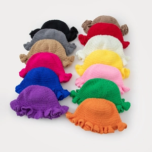 Handmade crochet knit bucket hat with ruffled brim available in thirteen solid colors