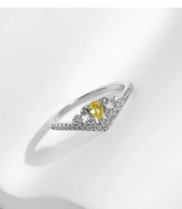Macro shot of s925 silver crown ring with yellow teardrop gem and pavé diamonds