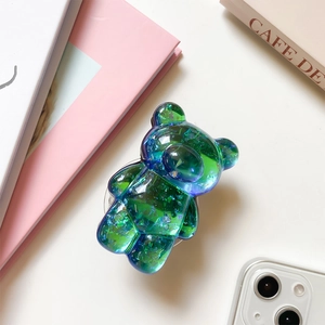Close-up of bear-shaped phone grip with laser aurora sequins and blue-green gradient