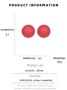 Detail showing pink candy-colored acrylic sphere earrings with S925 silver needles