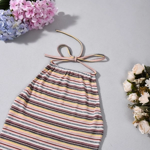 Detailed flat lay of a colorful striped halter top with backless tie-up design