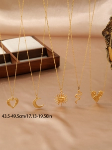 Detailed display of vintage 18k gold plated titanium steel pendants with various patterns