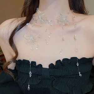 Close-up of layered transparent flower necklace with acrylic petals and crystal beads